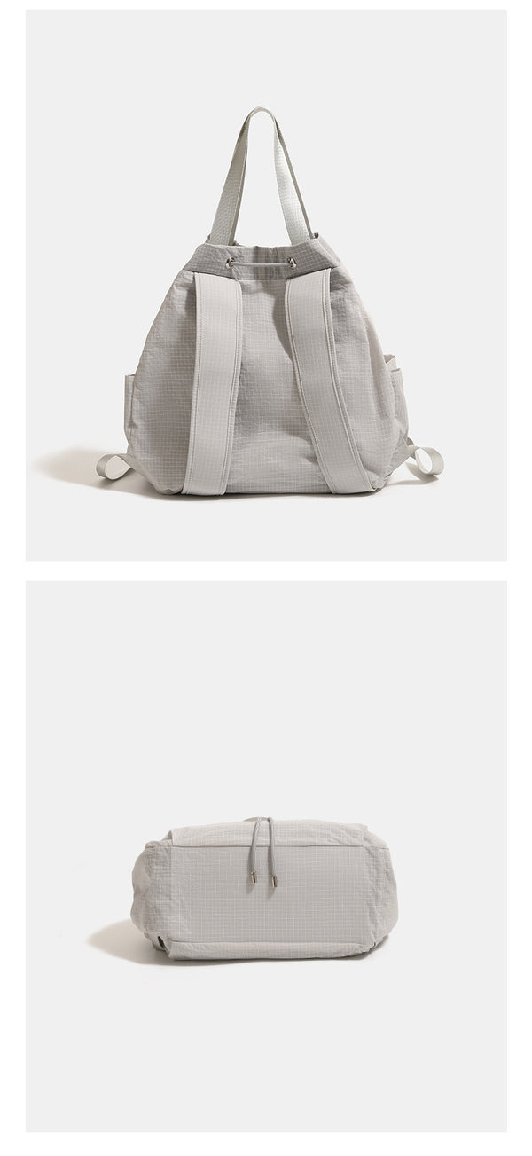 Large glacier gray grid-texture nylon drawstring backpack tote with dual top handles and adjustable backpack straps, detail