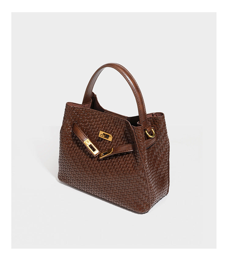 Structured woven leather-look bucket bag with gold-tone turn-lock hardware and detachable shoulder strap, detail view 17