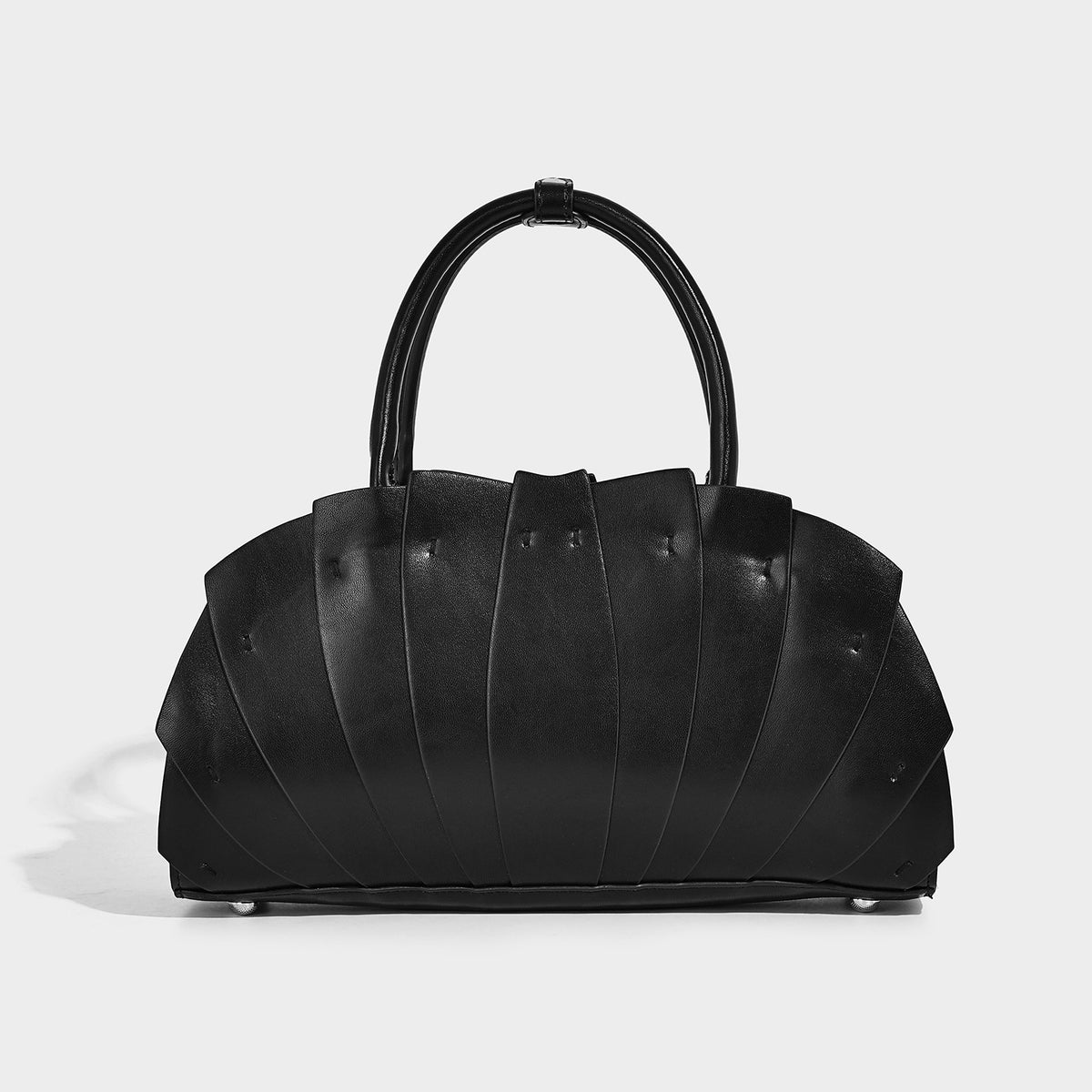Structured dome satchel with fan-pleated leather-look exterior, dual top handles, and detachable shoulder strap, detail view