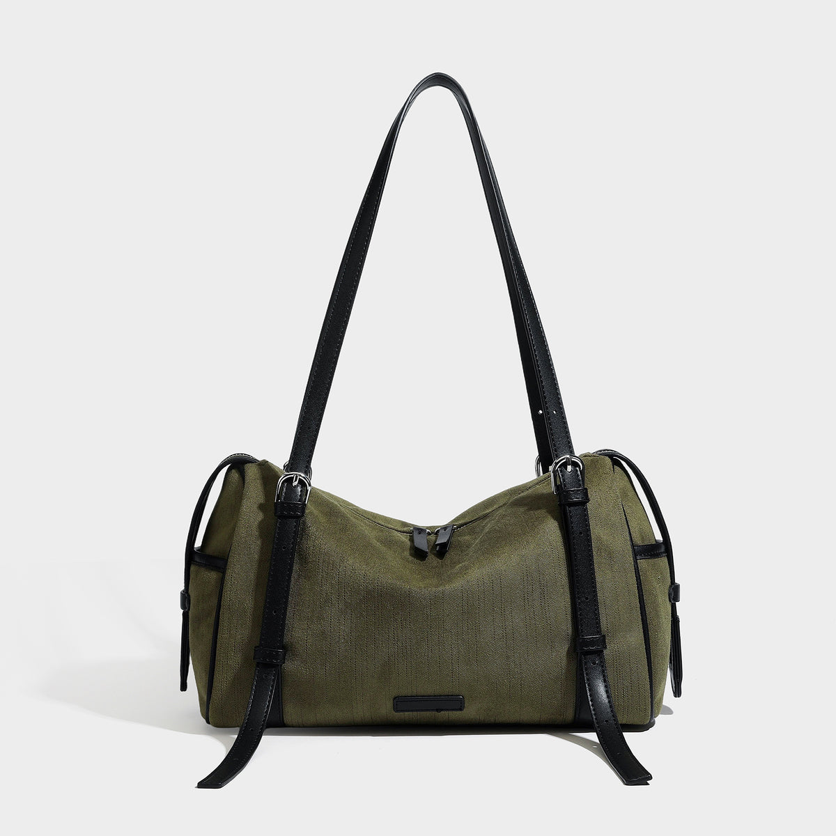 Olive green canvas barrel shoulder bag with black leather-look straps, zip-top closure, and silver-tone hardware, front view