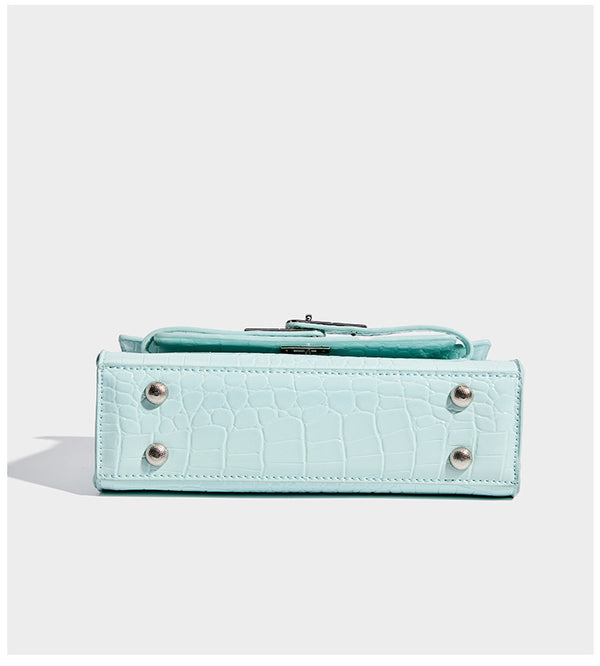 Compact structured flap satchel with glossy crocodile-embossed leather-look finish, silver-tone turn-lock hardware, and
