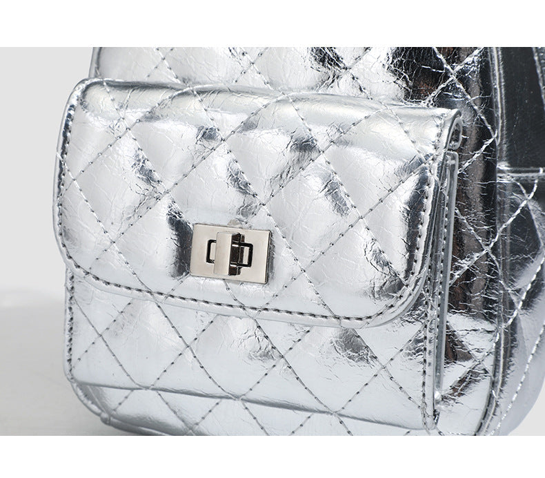 Quilted leather-look backpack purse with chain strap and turn-lock front pocket, detail view 13