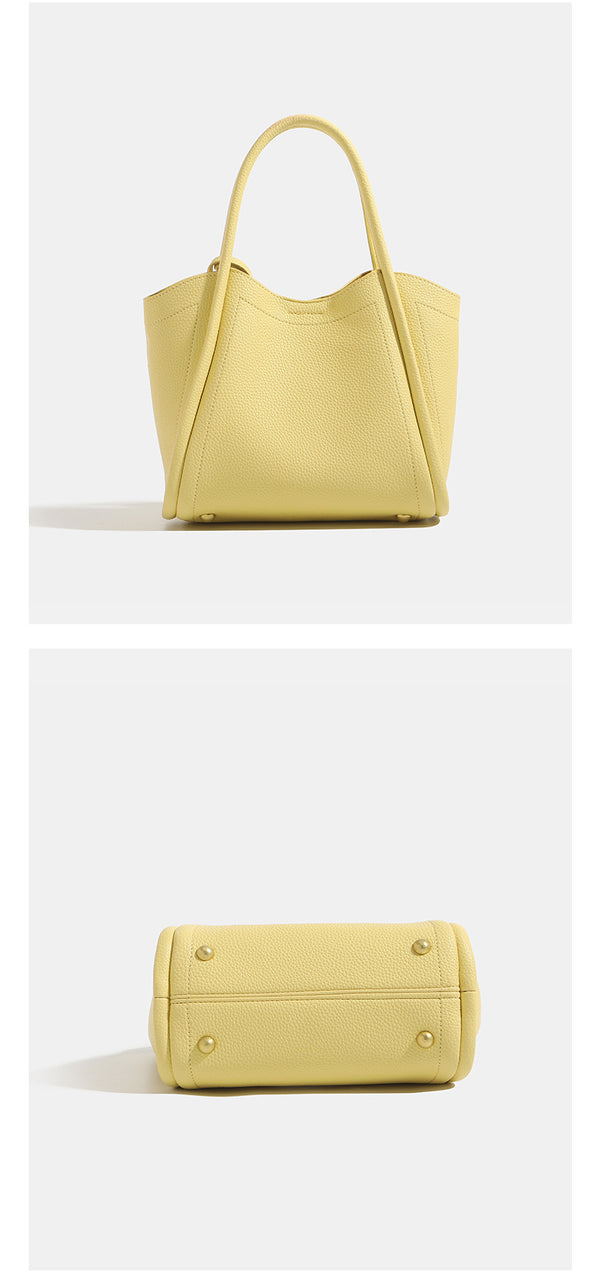 Small structured pebbled leather-look bucket tote bag with bow charm tie closure and gold-tone hardware, detail view 13