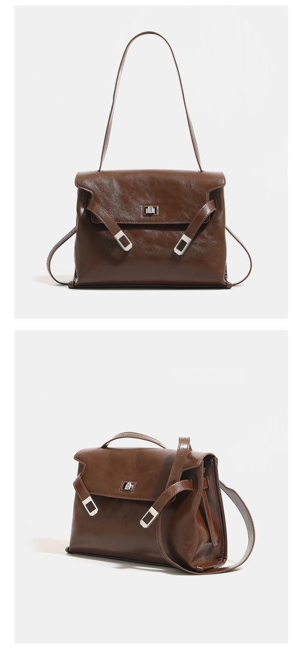 Structured rectangular flap shoulder bag in glossy leather-look finish with silver turn-lock clasp and adjustable strap