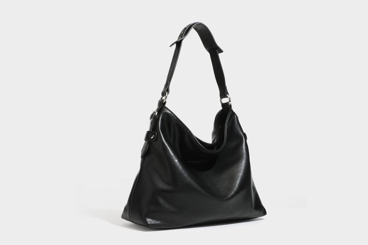 Large slouchy hobo shoulder bag in dark brown with smooth leather-look finish, adjustable strap, and silver-tone hardware