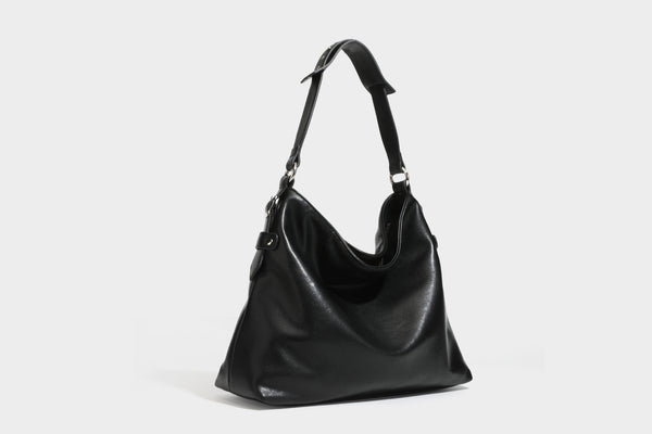Large slouchy hobo shoulder bag in dark brown with smooth leather-look finish, adjustable strap, and silver-tone hardware