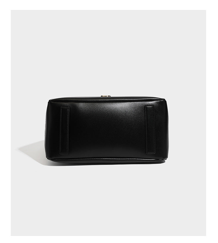 Structured glossy leather-look tote shoulder bag with dual top handles, detachable crossbody strap, side pockets, and, detail