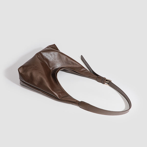 Large slouchy hobo shoulder bag in smooth leather-look finish with adjustable strap and gold-tone hardware, detail view 4