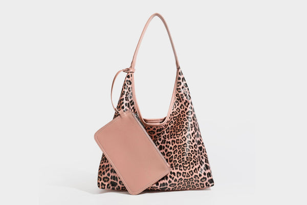 Glossy leopard-print slouchy shoulder bag with long strap and detachable tan zip pouch, detail view 34
