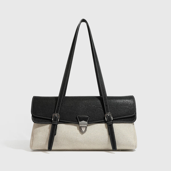 Strukturierte zweifarbige Schultertasche mit schwarzer Klappe in Lederoptik, cremefarbenem Korpus mit Webstruktur, silberfarbenem Drehverschluss und Doppel