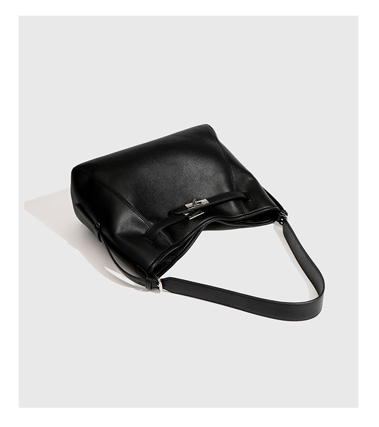 Large black pebbled leather-look hobo shoulder bag with silver-tone turn-lock front hardware and single flat adjustable