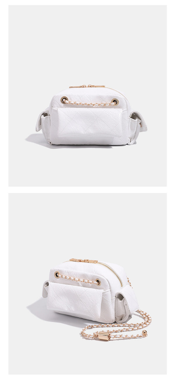 Compact quilted diamond-stitch crossbody bag with gold-tone chain strap and top zip closure, detail view 10