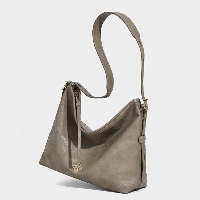 Slouchy leather-look hobo shoulder bag with gold-tone hardware and adjustable strap in brown, detail view 15