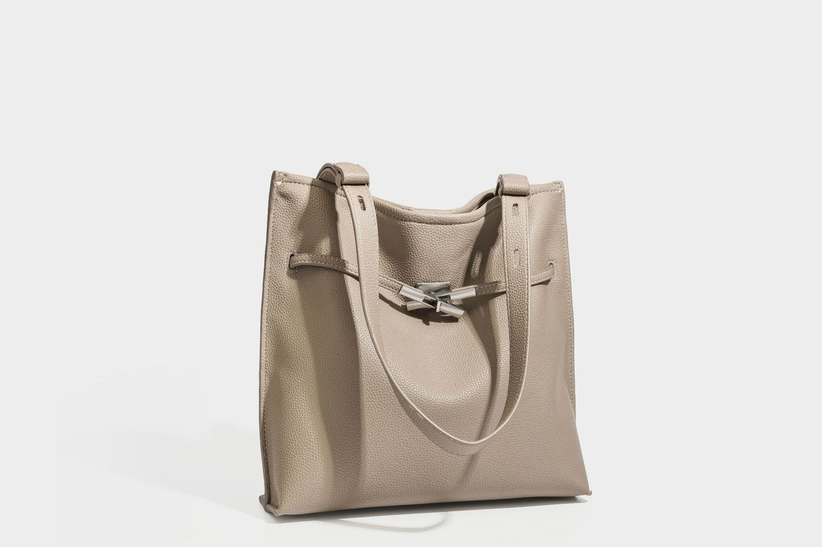 Pebbled leather-look tote bag with front toggle hardware and long shoulder strap, detail view 25