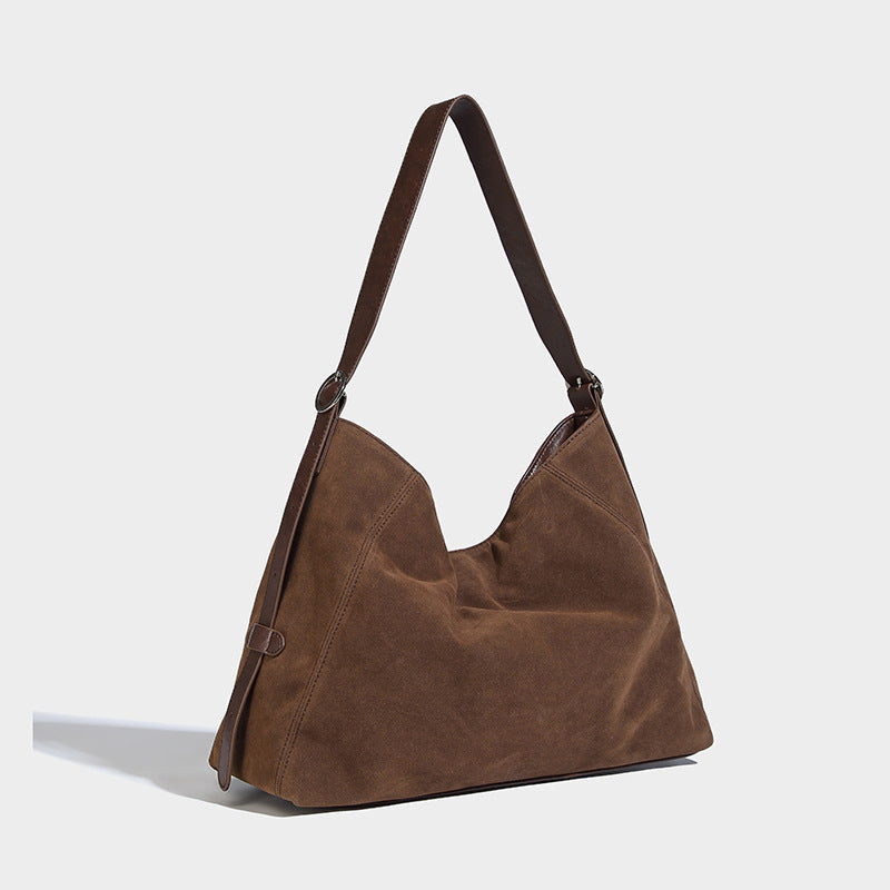 Slouchy hobo shoulder bag with turn-lock flap closure and adjustable strap, detail view 21