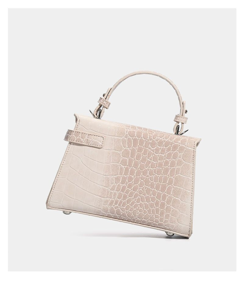 Croc-embossed mini top-handle satchel with silver turn-lock closure and adjustable crossbody strap, detail view 14