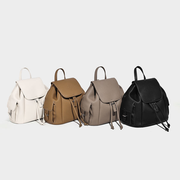 Compact pebbled leather-look flap drawstring backpack handbag with side pockets, top handle, and silver-tone hardware, detail