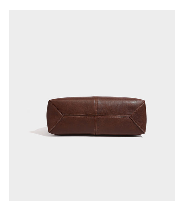 Structured rectangular satchel bag with dual rounded top handles and central metal turn-lock flap closure, detail view 12