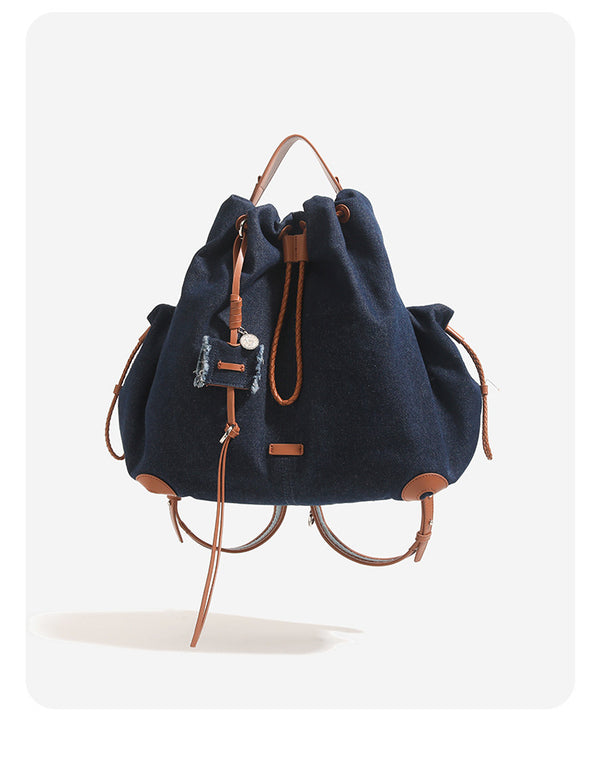 Lässiger Rucksack in Beutelform mit Kordelzugverschluss, Besätzen in cognacfarbener Kunstlederoptik und Eckenschonern, Detailansicht 8