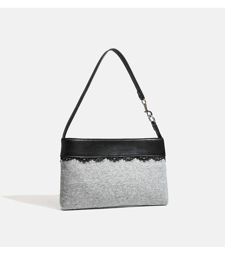 Compact gray textile shoulder bag with lace trim and smooth leather-look strap, detail view 11