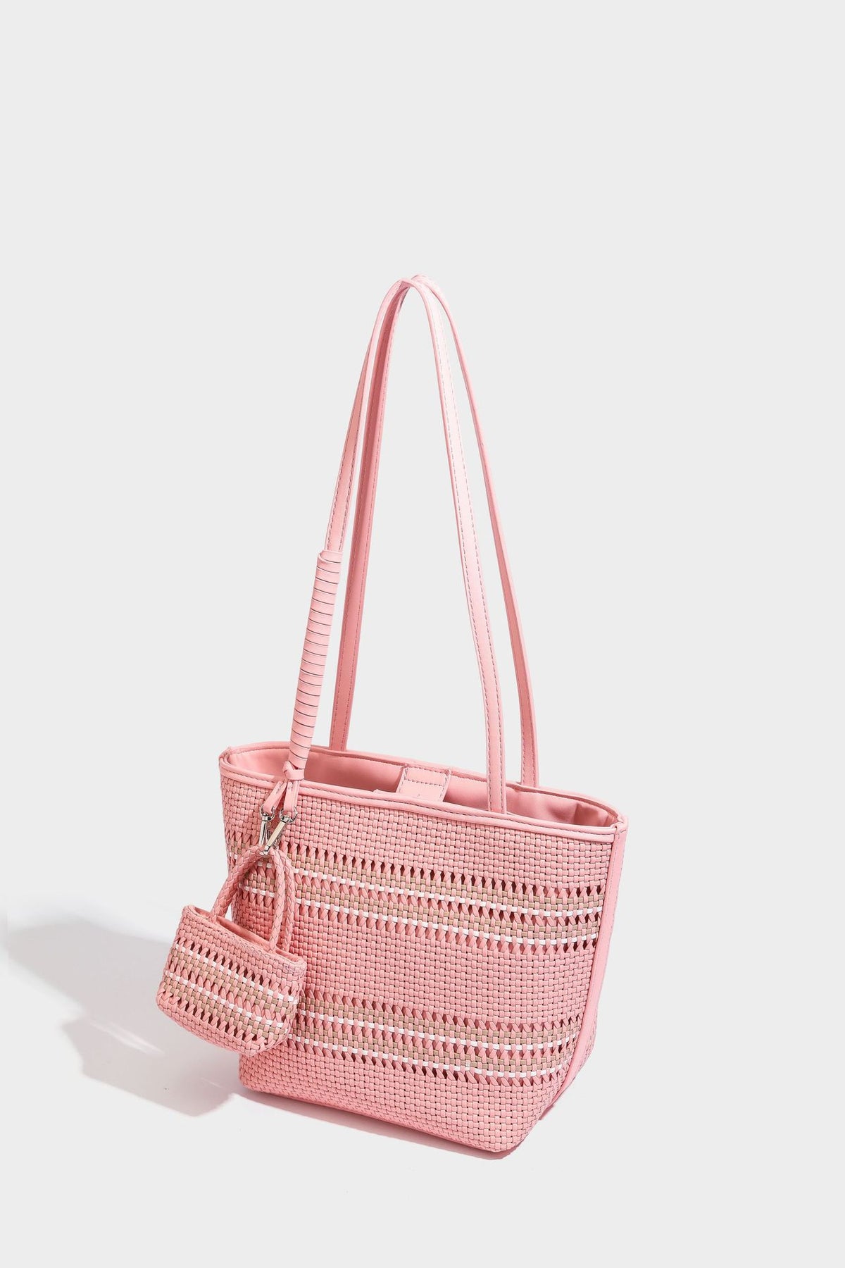 Large structured woven tote bag with striped basket-weave finish, long shoulder straps, and detachable mini pouch charm