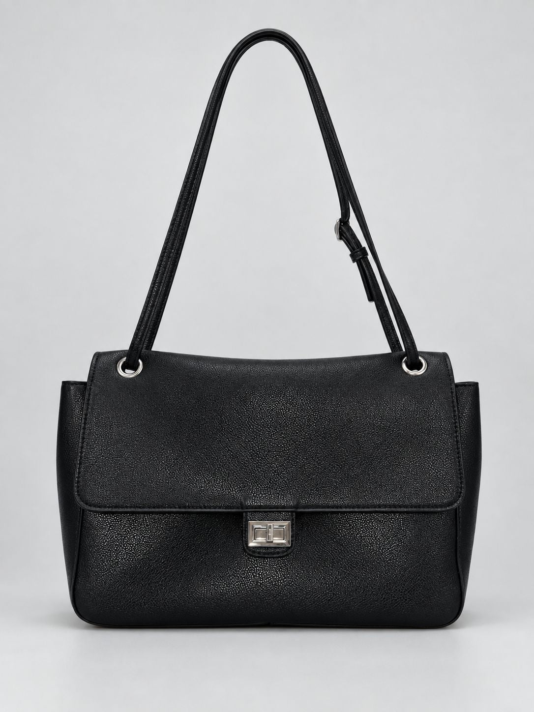 Structured black flap shoulder bag with pebbled texture, silver-tone turn-lock closure, and adjustable single shoulder strap