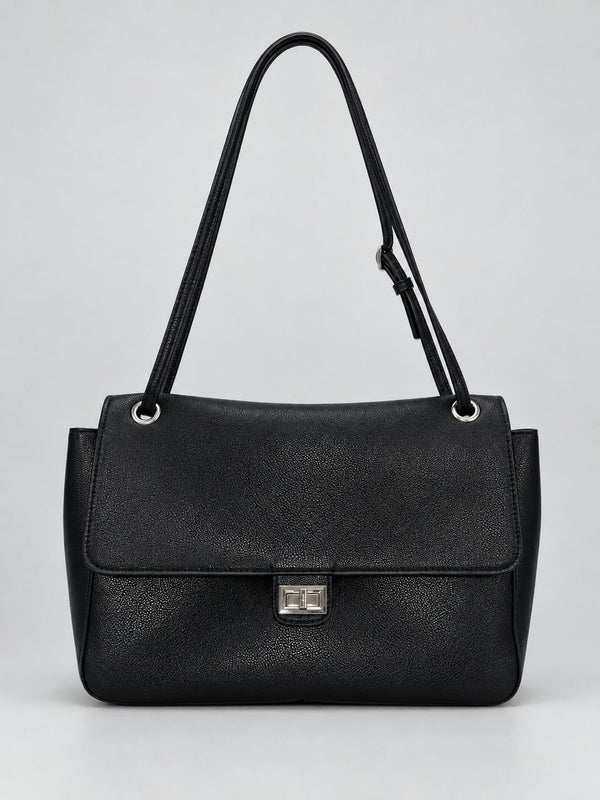 Structured black flap shoulder bag with pebbled texture, silver-tone turn-lock closure, and adjustable single shoulder strap