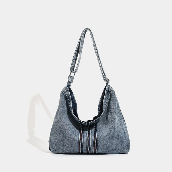Oversized washed denim hobo shoulder bag with contrast stripe stitching and wide adjustable strap, detail view 6