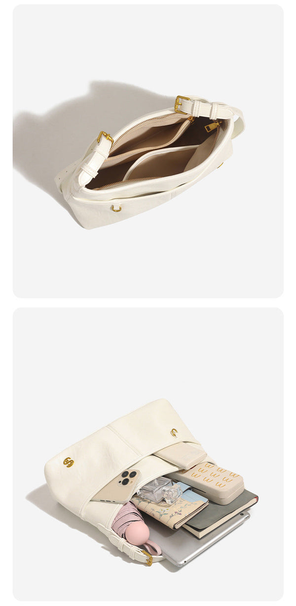 Relaxed leather-look shoulder tote bag in cream white with front exterior pocket, gold-tone ring hardware, and adjustable