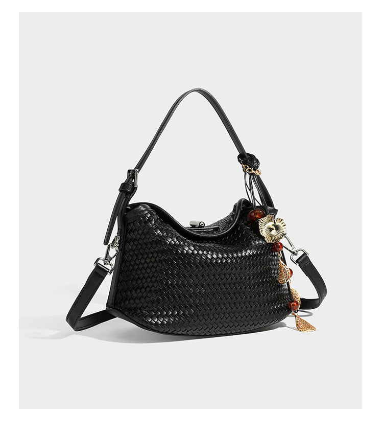 Small woven-look leather-look flap shoulder hobo bag in burgundy with silver-tone hardware and decorative tassel charm