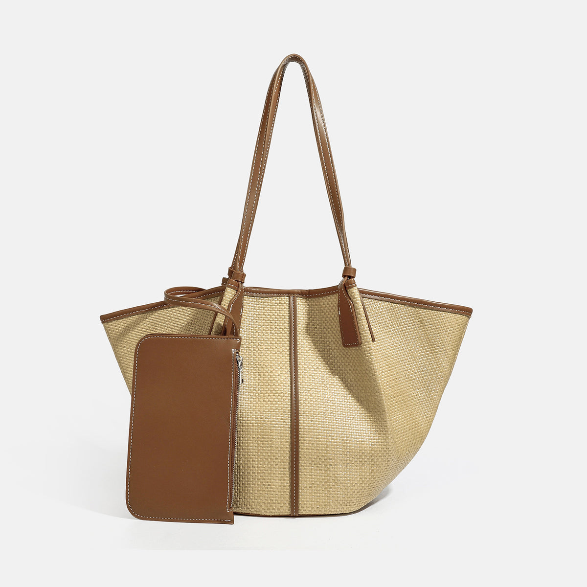 Tan woven tote bag with contrasting leather-look trim, long shoulder straps, and detachable rectangular zip pouch, detail