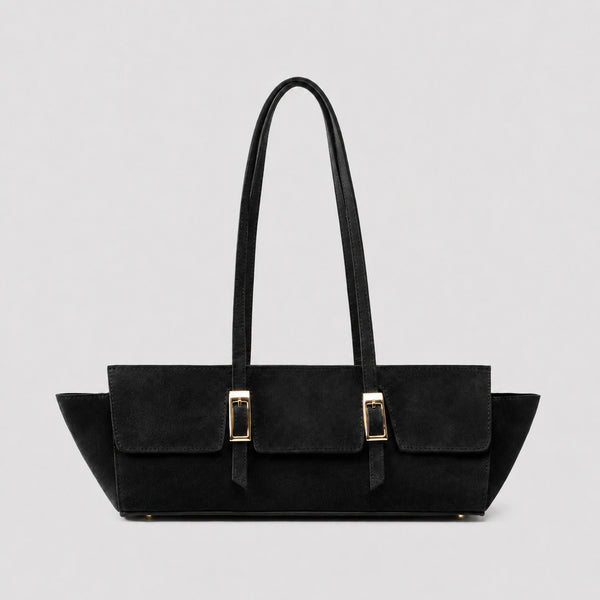 Wide trapezoid tote bag with matte suede-like finish, dual gold-tone buckle front pockets, and double flat shoulder straps