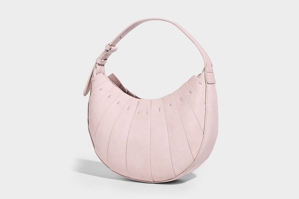 Crescent half-moon shoulder bag with vertical panel seaming, matte-satin leather-look finish, and adjustable gold-tone