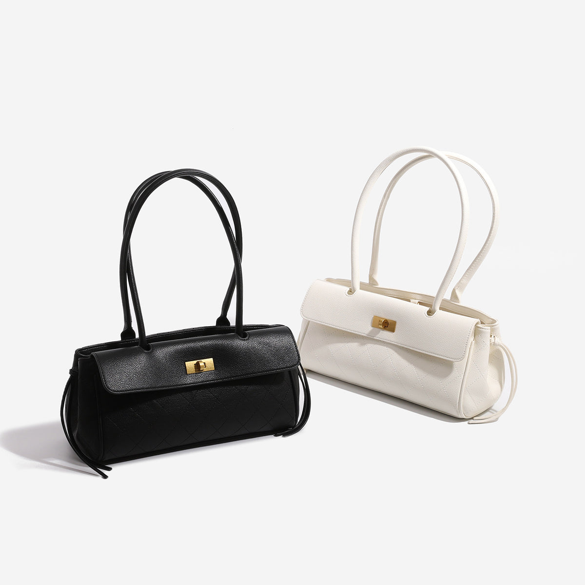 Structured quilted diamond top-handle underarm shoulder bag with gold-tone turn-lock flap closure and side tie straps, detail