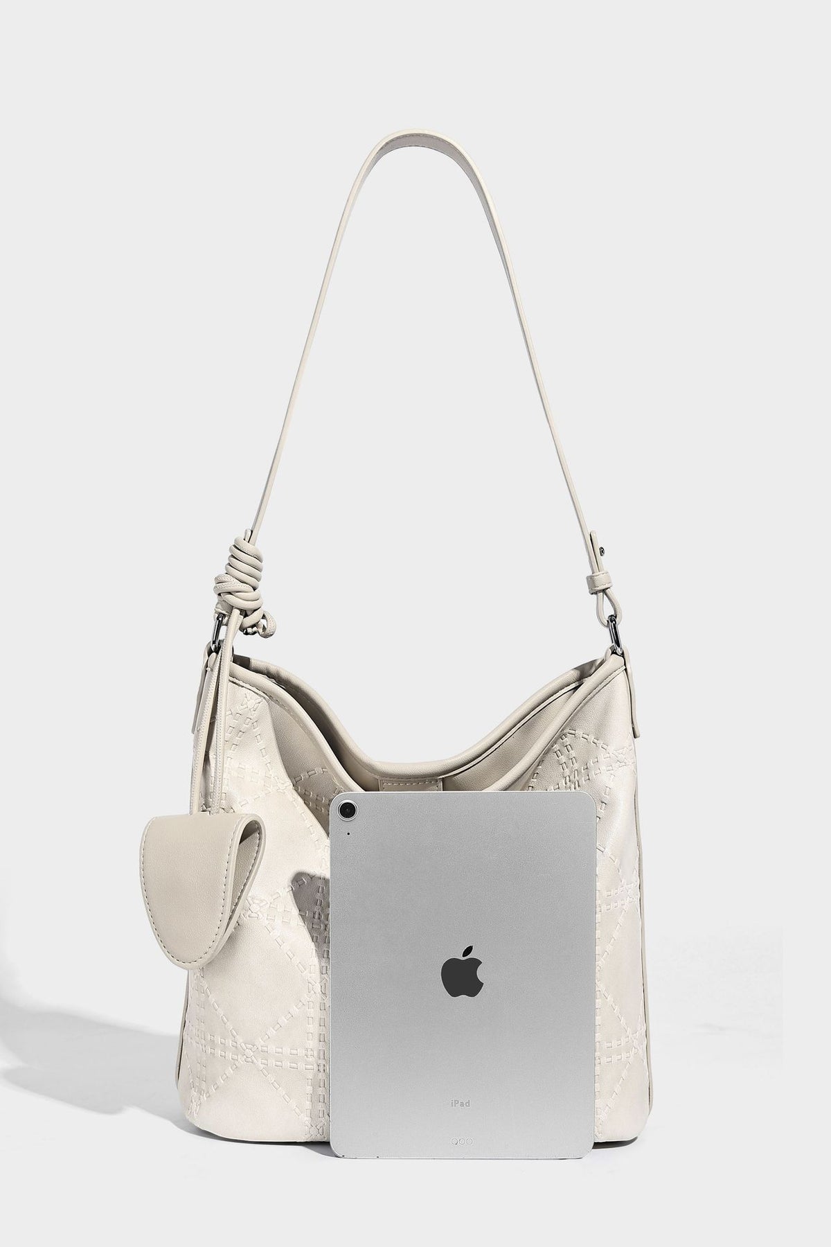 Diamond-quilted leather-look bucket shoulder bag with knotted strap accent and attached mini pouch, detail view 21