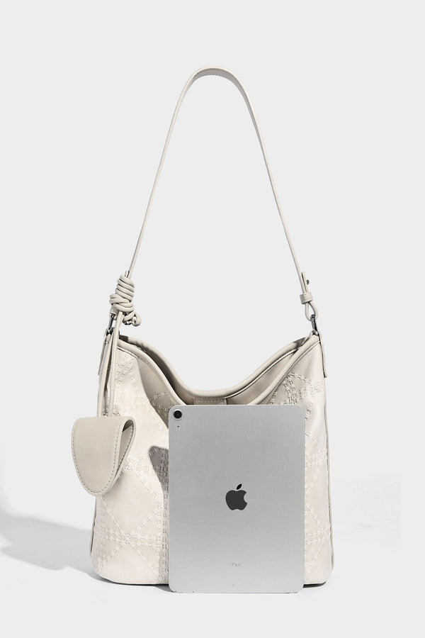Diamond-quilted leather-look bucket shoulder bag with knotted strap accent and attached mini pouch, detail view 21