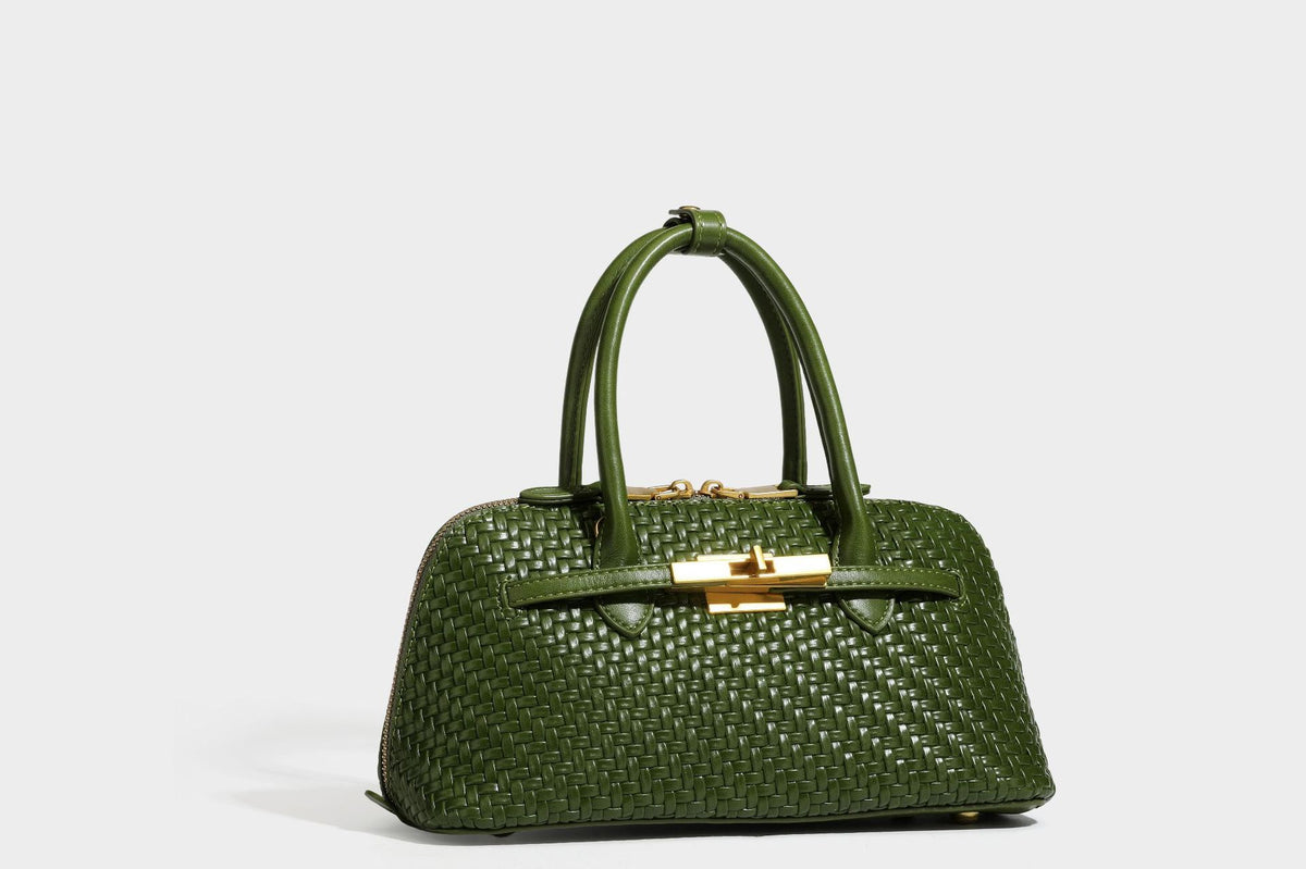 Structured woven-embossed leather-look satchel with dual rolled top handles, gold-tone turn-lock closure, and detachable