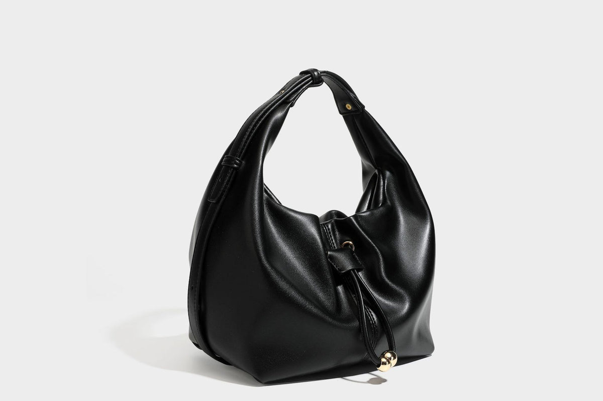 Slouchy hobo bag with smooth leather-look finish, drawstring cinch closure, and gold-tone bead hardware, detail view 25