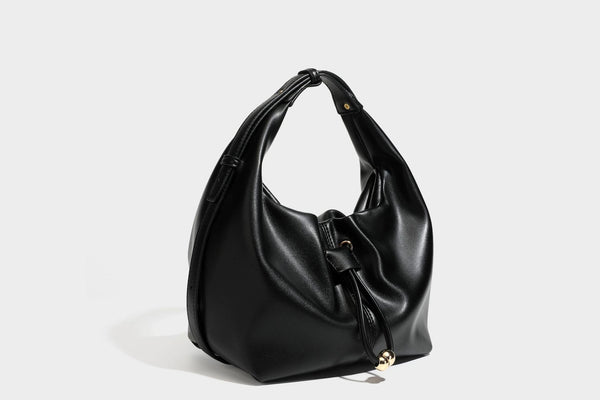 Slouchy hobo bag with smooth leather-look finish, drawstring cinch closure, and gold-tone bead hardware, detail view 25