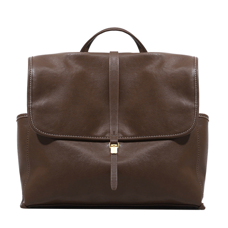 Structured retro flap backpack handbag in brown leather-look finish with gold-tone toggle clasp and top handle, detail view 5
