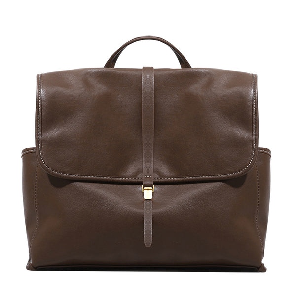 Structured retro flap backpack handbag in brown leather-look finish with gold-tone toggle clasp and top handle, detail view 5