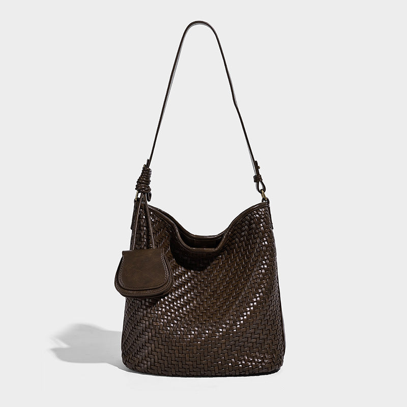 Woven leather-look bucket bag with basket-weave texture, attached mini pouch, and adjustable shoulder strap, detail view 8