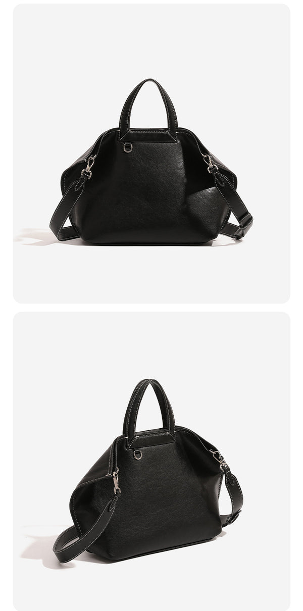 Structured cognac brown leather-look tote bag with fold-ear side panels, top handles, gold-tone hardware, and detachable