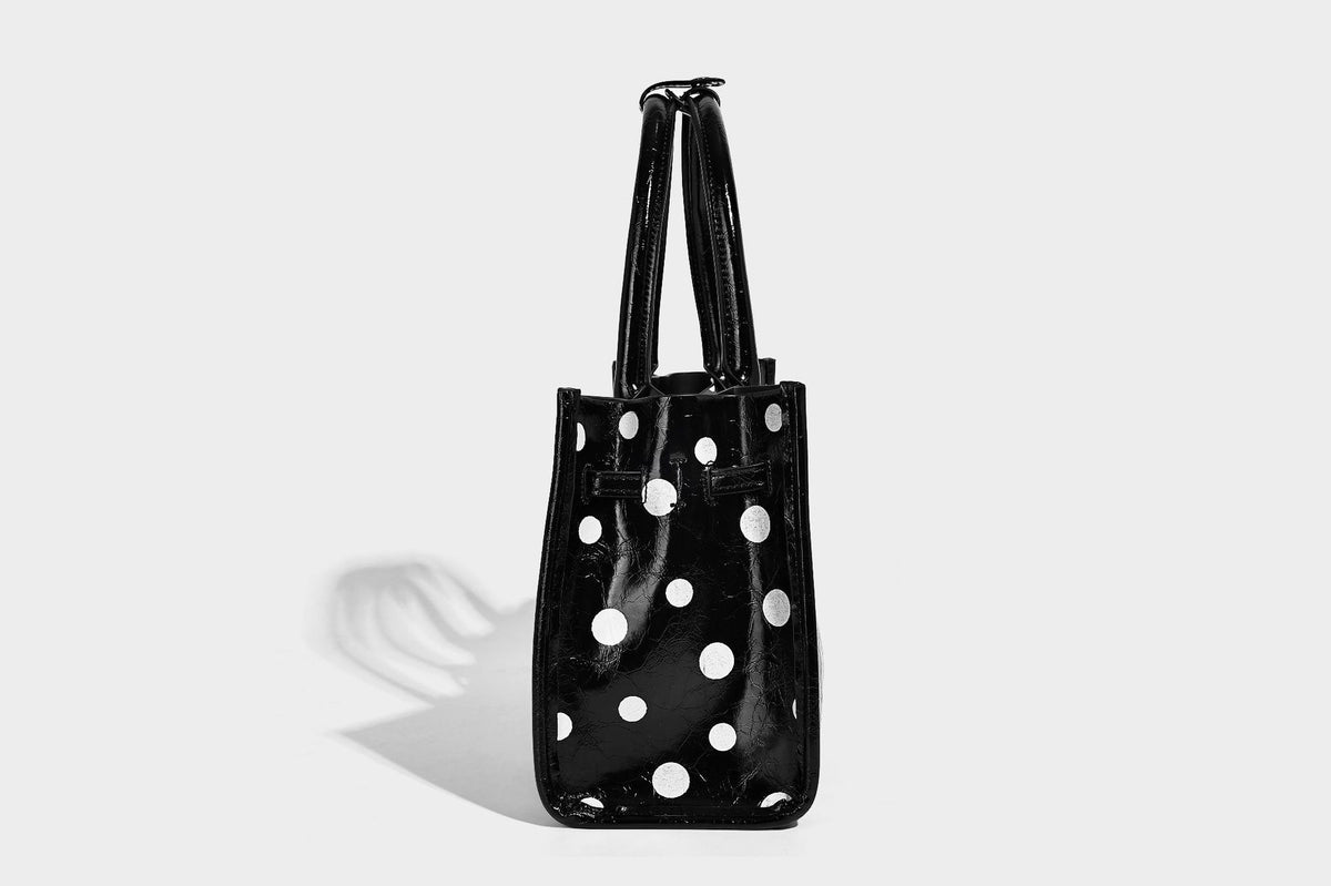 Structured glossy leather-look polka-dot satchel tote with dual top handles and detachable shoulder strap, detail view 16