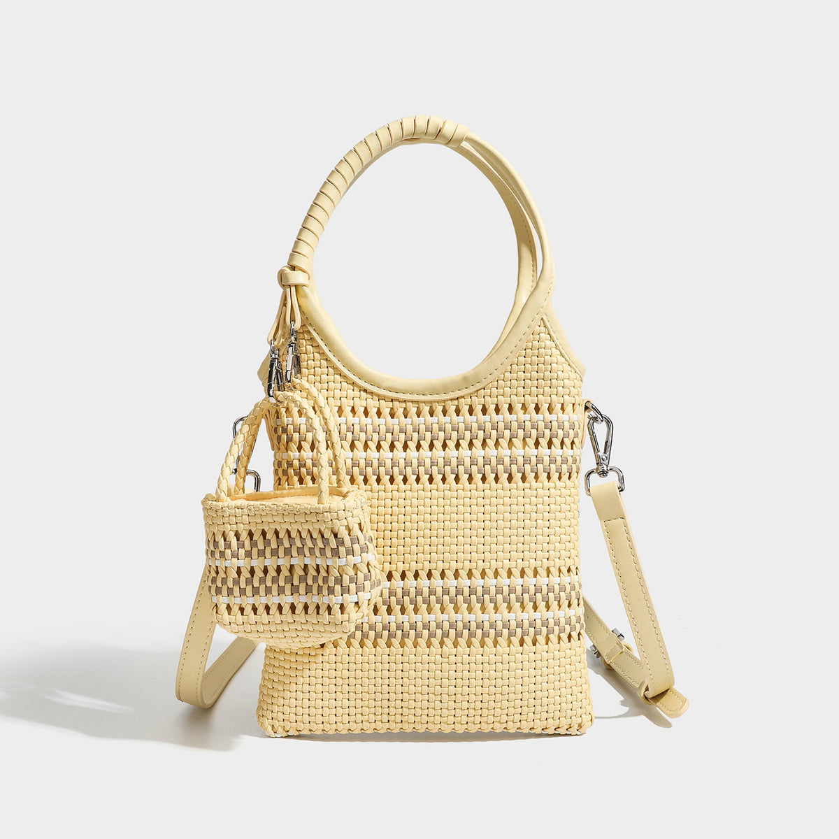 Color-block woven tote bag with rounded leather-look handles, detachable crossbody strap, and matching mini clip-on pouch in