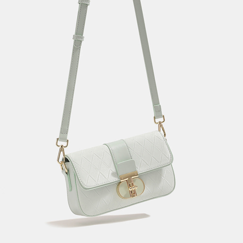 Small structured quilted diamond flap bag in mint green with gold turn-lock closure and detachable chain crossbody strap