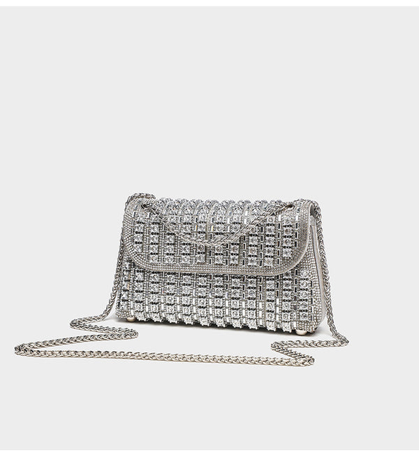 Structured mini flap crossbody bag covered in grid-set rhinestones with silver-tone chain strap, detail view 7