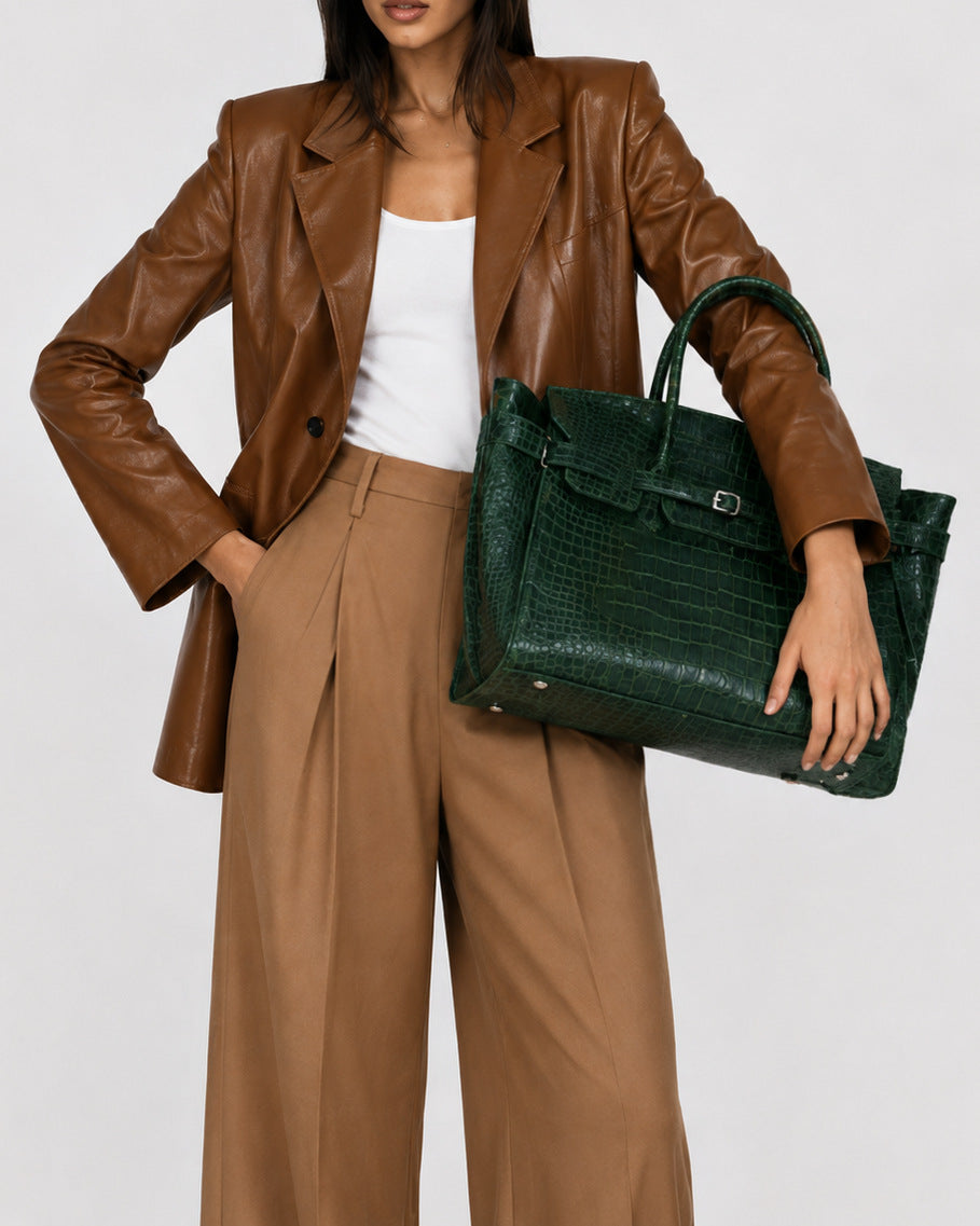 Large structured tote satchel with glossy crocodile-embossed leather-look finish, dual top handles, and metal buckle flap
