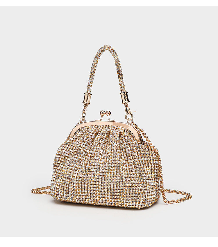 Kompakte Abendtasche mit durchgehendem Strassbesatz, silberfarbenem Metallrahmen, Strass-Tragegriff und abnehmbarer Kette