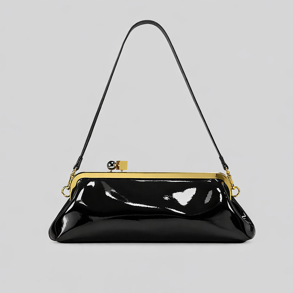 Strukturierte Clutch mit Kiss-Lock-Rahmenverschluss aus dunkelbrauner, krokodil-geprägter Lederoptik mit goldfarbenen Details und schmalem